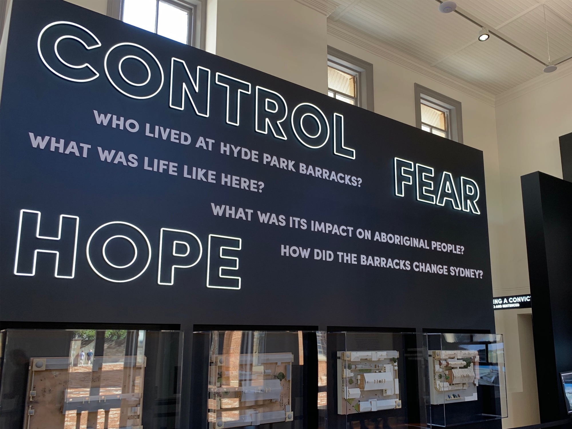 Illuminated interpretive signage installed inside the World Heritage-listed Hyde Park Barracks in Sydney.